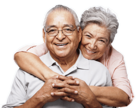 Elderly Couple hugging each other smiling
