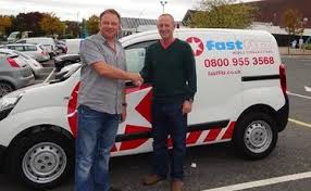 franchisee stood by van shaking hands with franchisor
